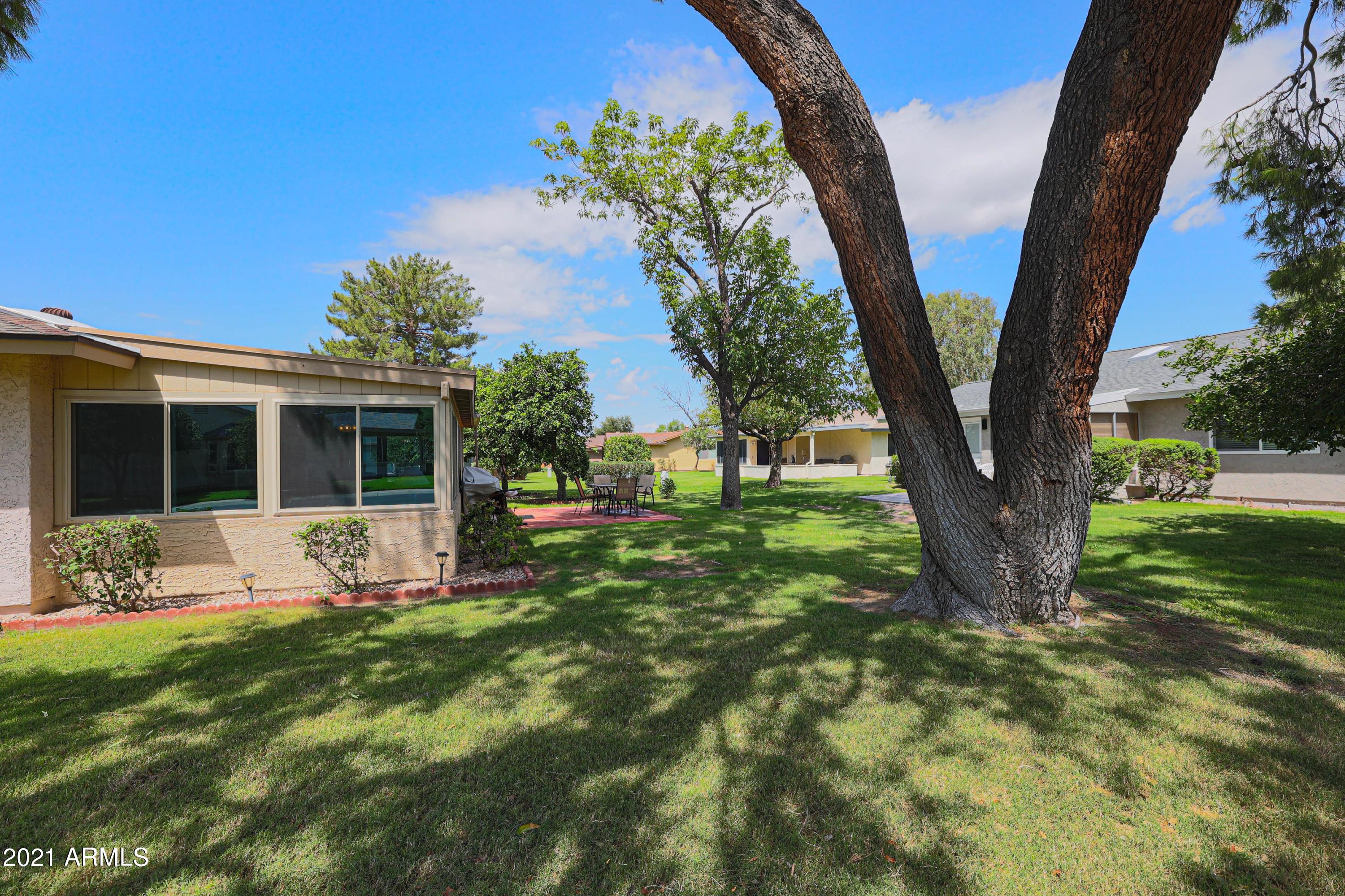 630 Leisure World Mesa, AZ 85206 - Photo 31 of 59 a front view of a house with garden