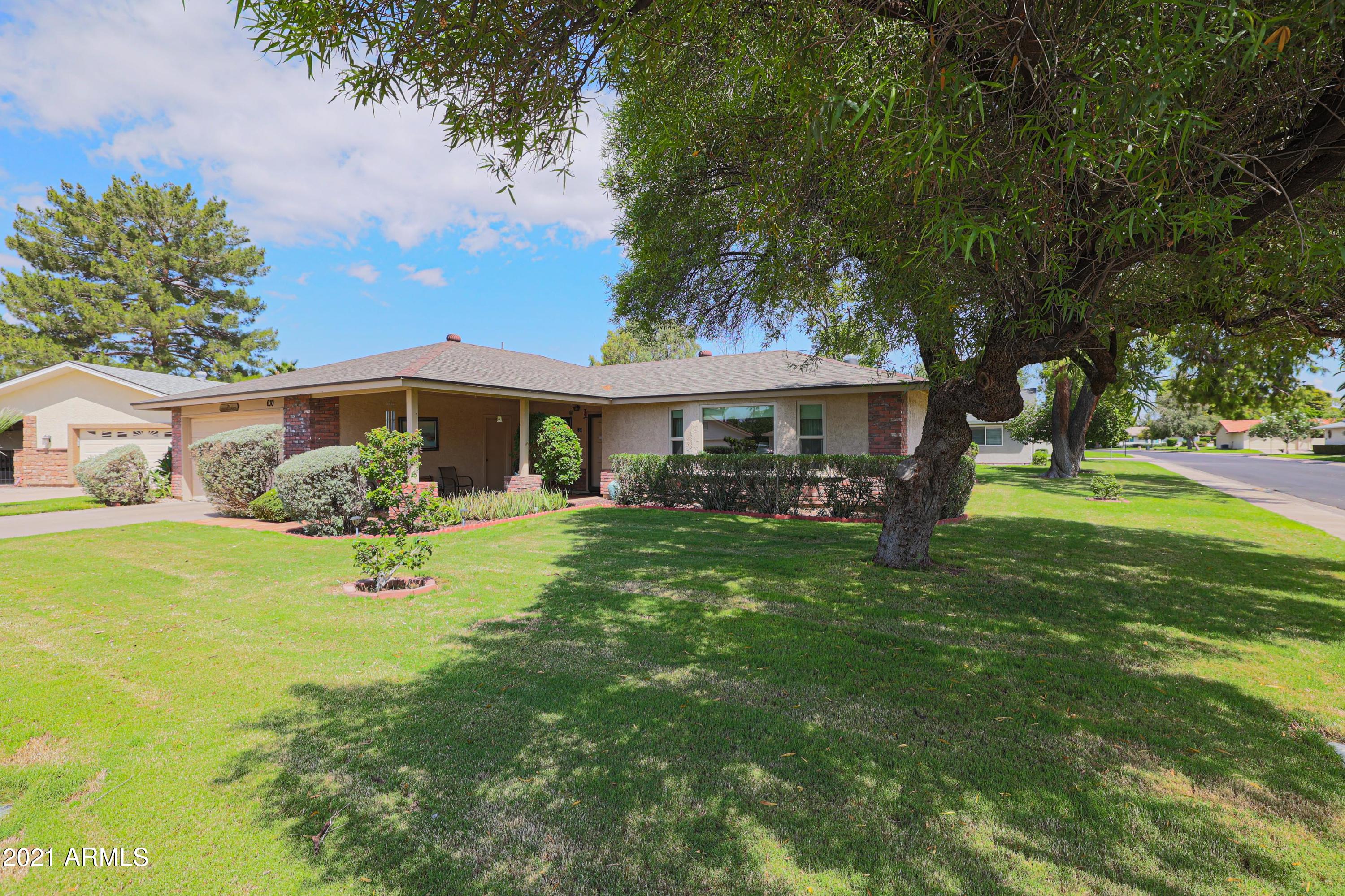 630 Leisure World Mesa, AZ 85206 - Photo 4 of 59 a front view of a house with garden