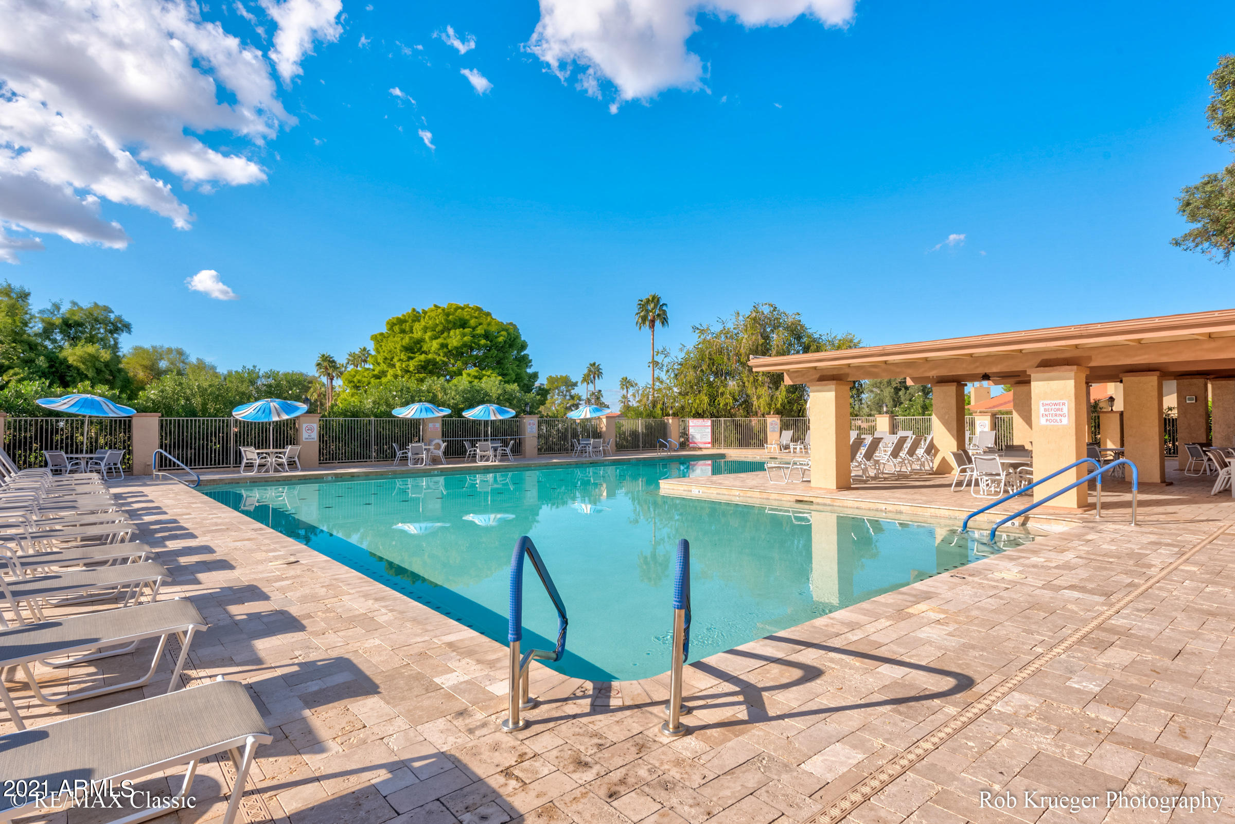 630 Leisure World Mesa, AZ 85206 - Photo 56 of 59 a view of a swimming pool with a patio