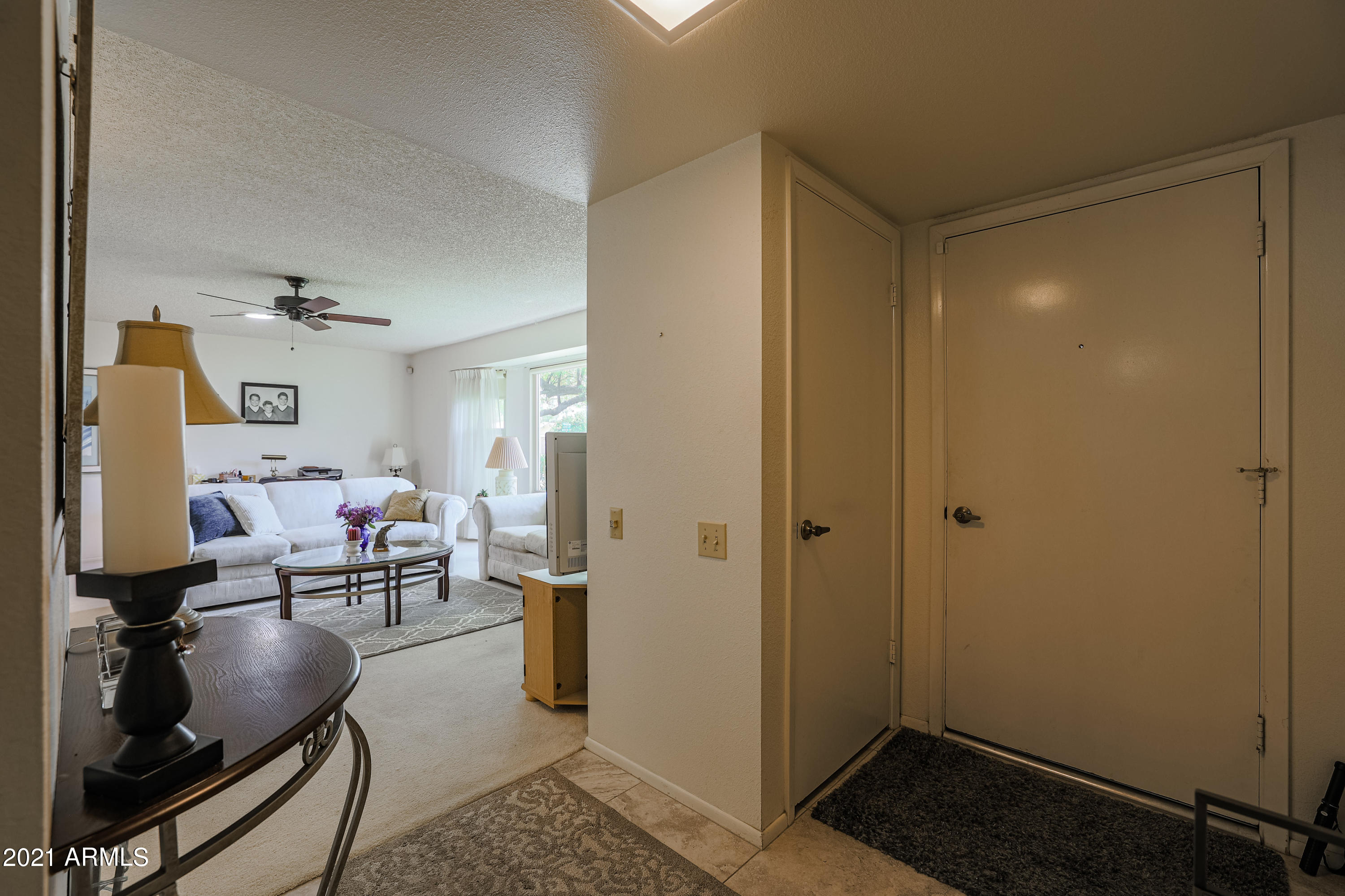 630 Leisure World Mesa, AZ 85206 - Photo 6 of 59 a living room with furniture and a window