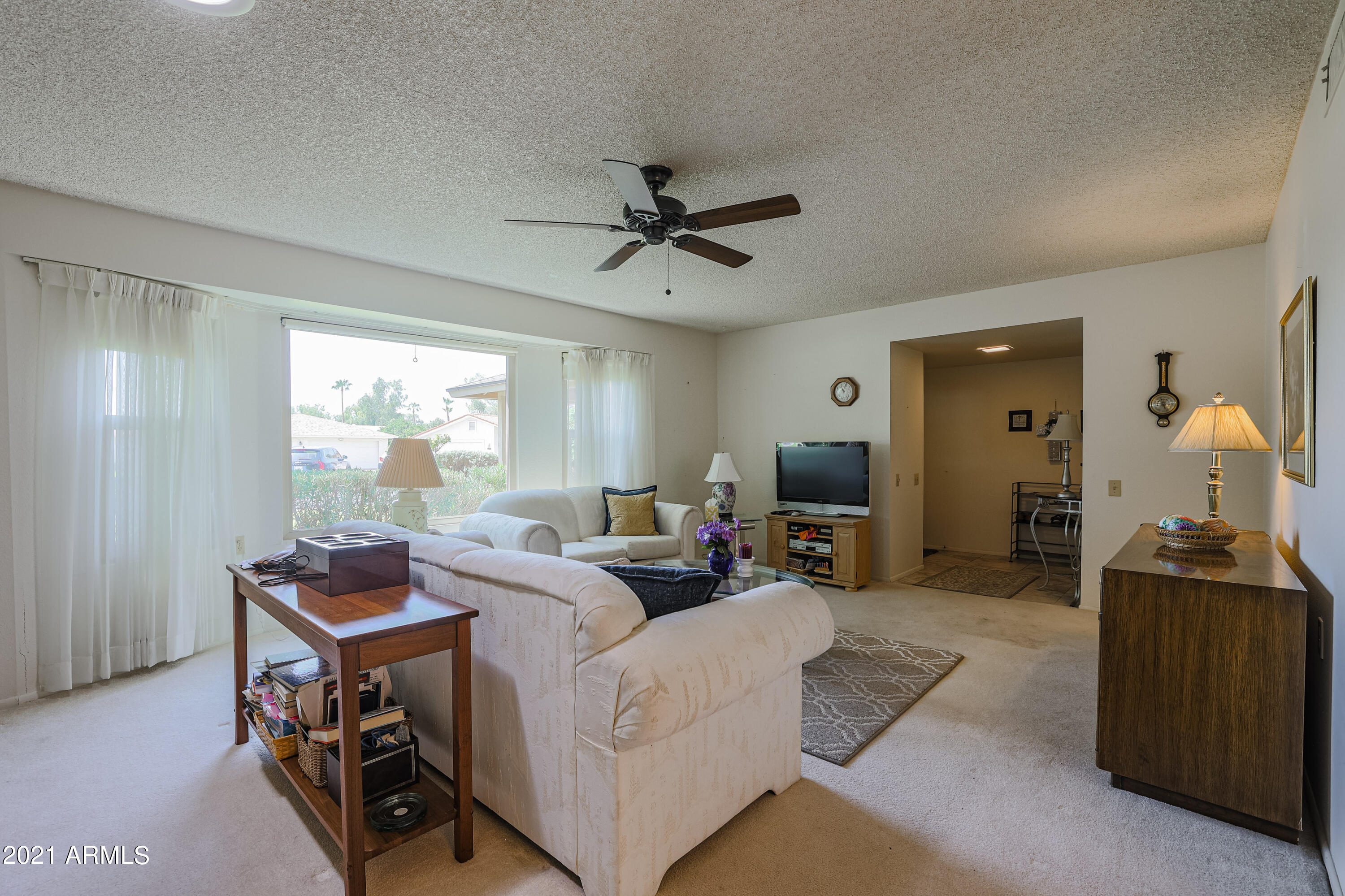 630 Leisure World Mesa, AZ 85206 - Photo 8 of 59 a living room with furniture and a window