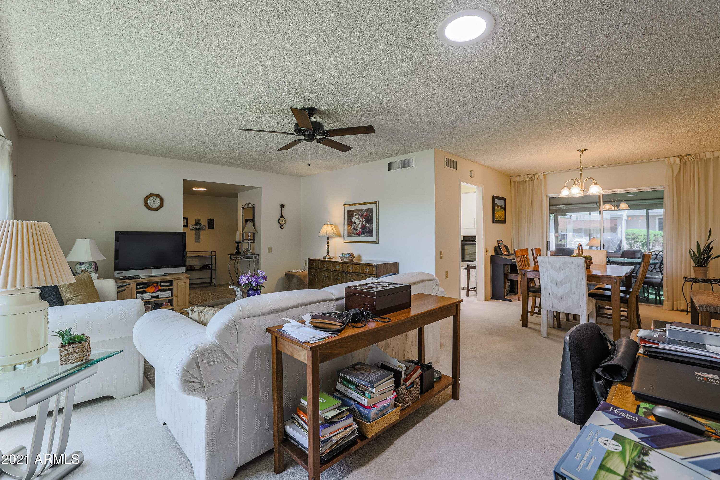 630 Leisure World Mesa, AZ 85206 - Photo 10 of 59 a living room with furniture and a flat screen tv