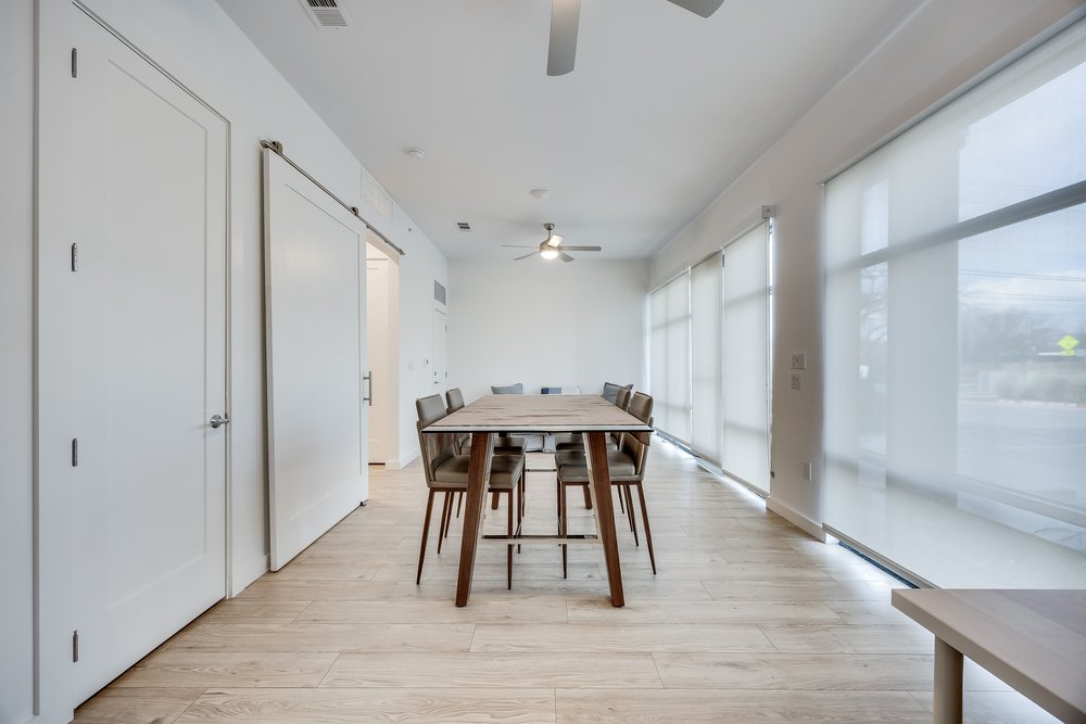 4801 Springdale Road, Unit 2107 Austin, TX 78723 - Photo 16 of 26 a view of a dining room with furniture and wooden floor