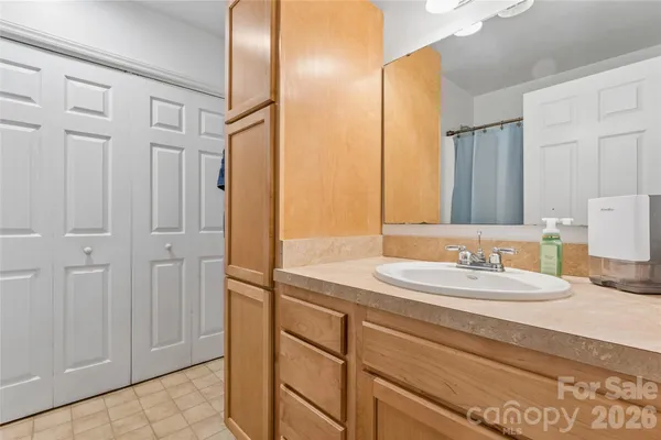 a bathroom with a double vanity sink and a mirror