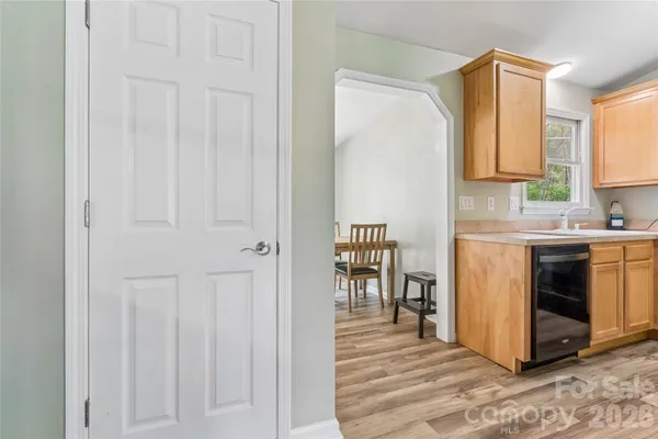 a kitchen with stainless steel appliances a white cabinet and a granite counter tops