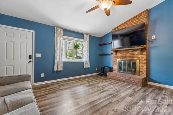 a bedroom with furniture window and wooden floor