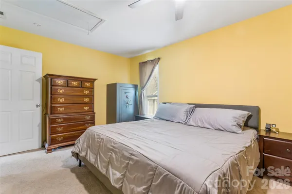 a bedroom with a bed and furniture