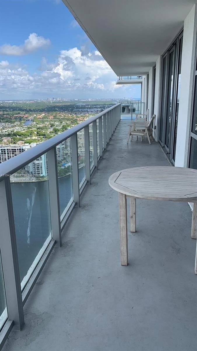 4010 South Ocean Drive, Unit R3004 Hollywood, FL 33019 - Photo 3 of 11 a view of a balcony with an outdoor space