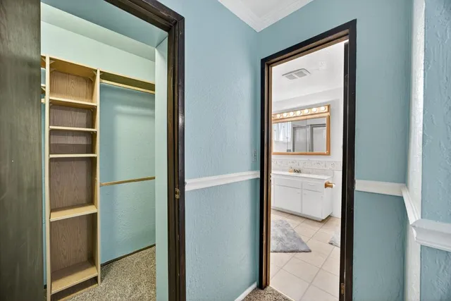 a view of bathroom with a toilet sink and a vanity