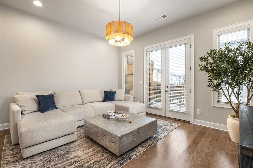 4751 Roswell Road Atlanta, GA 30342 - Photo 12 of 36 a living room with furniture and a large window