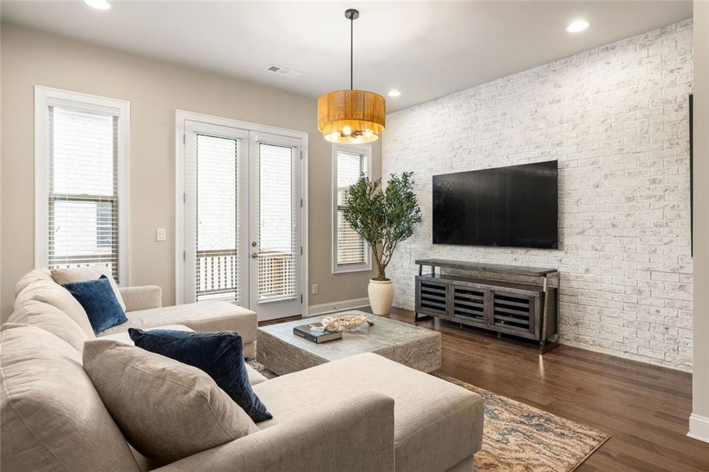 4751 Roswell Road Atlanta, GA 30342 - Photo 13 of 36 a living room with furniture and a flat screen tv