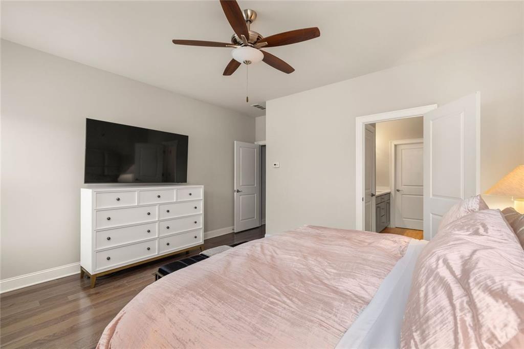 4751 Roswell Road Atlanta, GA 30342 - Photo 17 of 36 a bedroom with a bed and a flat screen tv