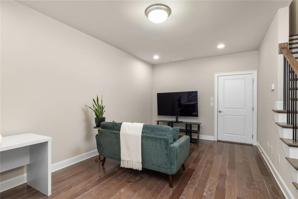 4751 Roswell Road Atlanta, GA 30342 - Photo 25 of 36 a living room with furniture and a flat screen tv