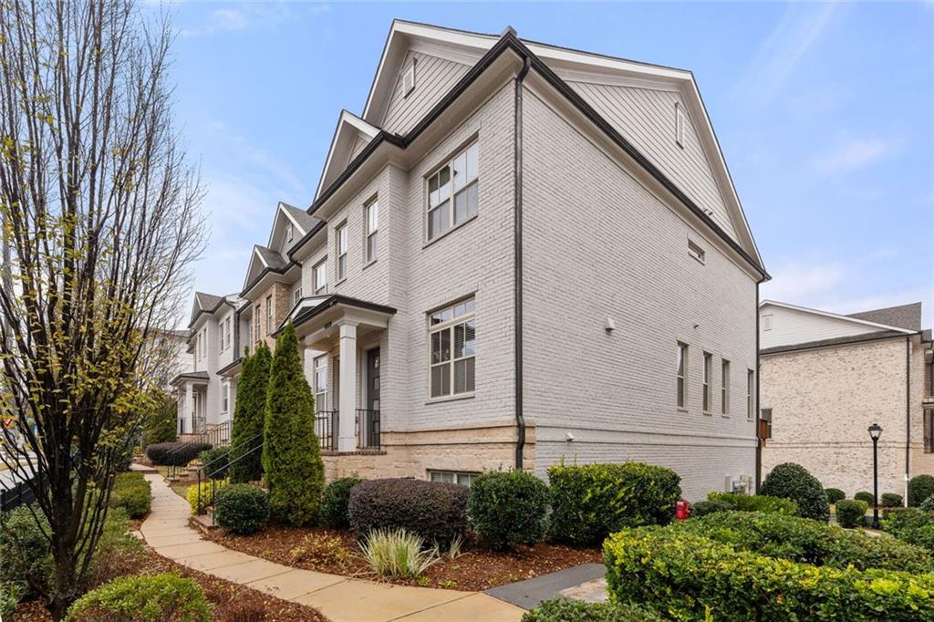 4751 Roswell Road Atlanta, GA 30342 - Photo 31 of 36 a view of a house with a yard
