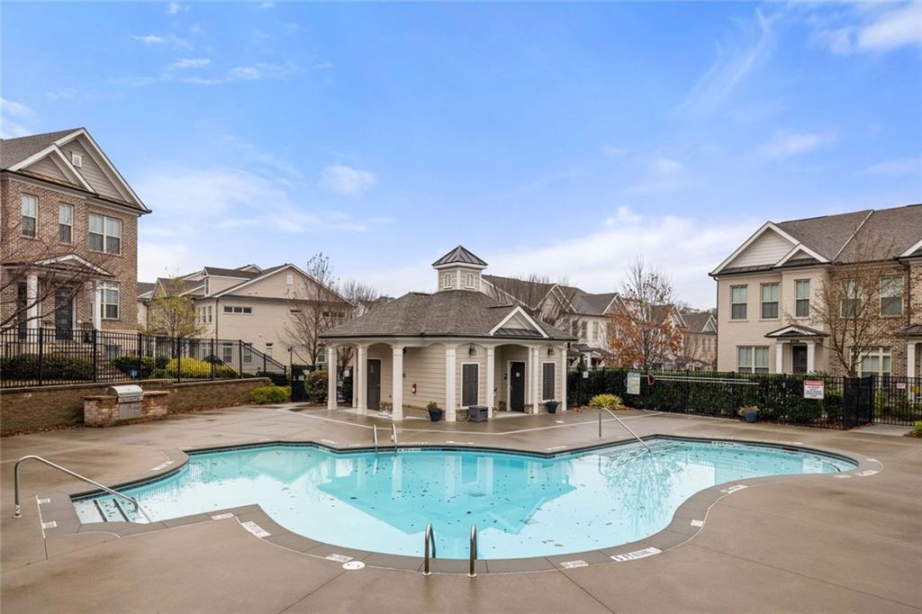 4751 Roswell Road Atlanta, GA 30342 - Photo 32 of 36 a view of a white house with a swimming pool