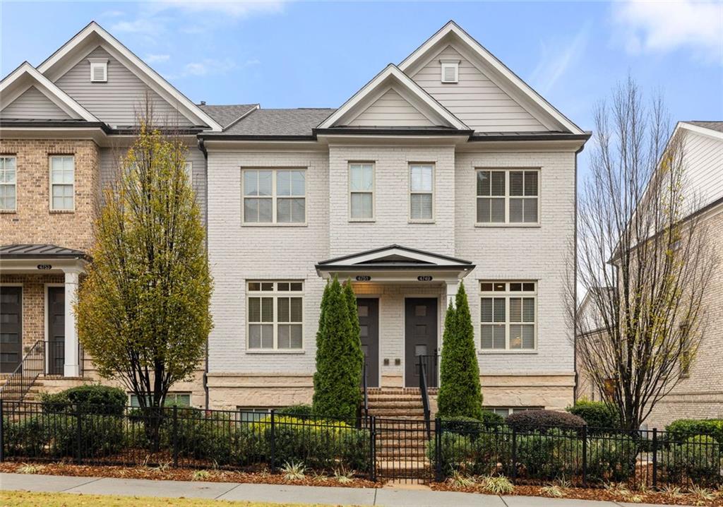 4751 Roswell Road Atlanta, GA 30342 - Photo 4 of 36 a front view of a house with a yard