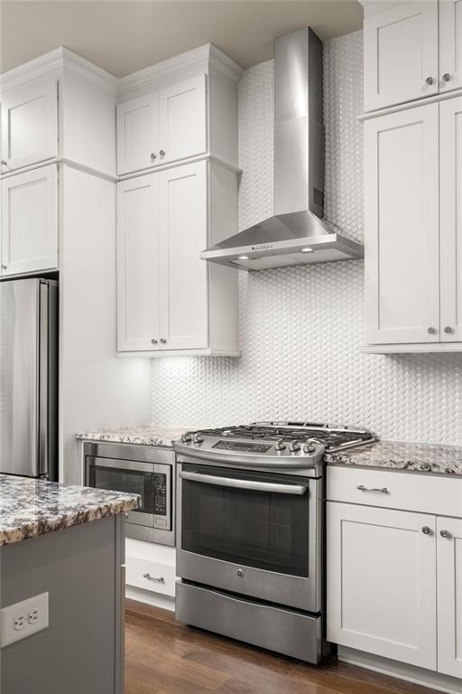 4751 Roswell Road Atlanta, GA 30342 - Photo 10 of 36 a kitchen with stainless steel appliances granite countertop a stove a sink and a refrigerator