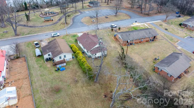 an aerial view of a house with outdoor space