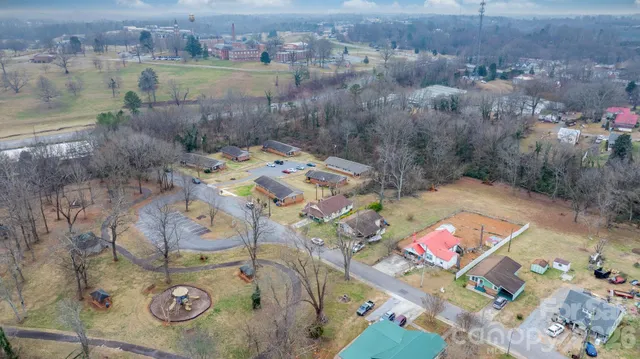 a view of a yard with large trees