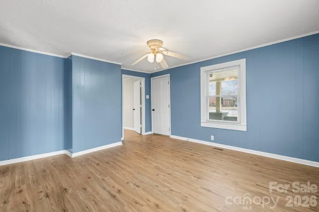 a view of a livingroom with a chandelier fan