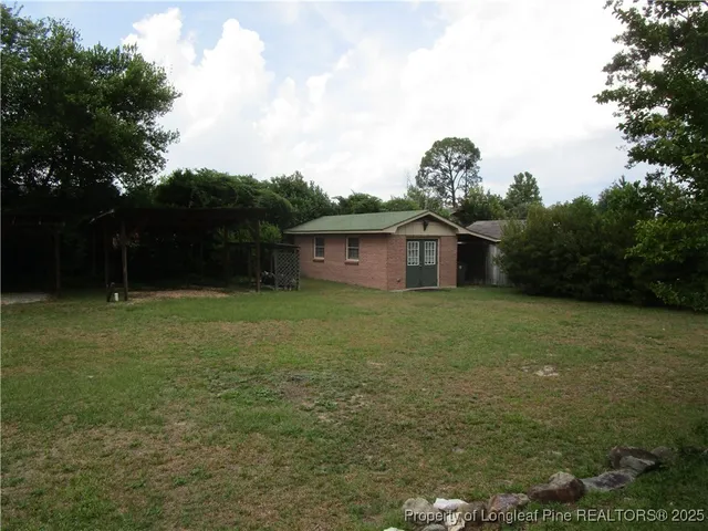 a house view with a garden space