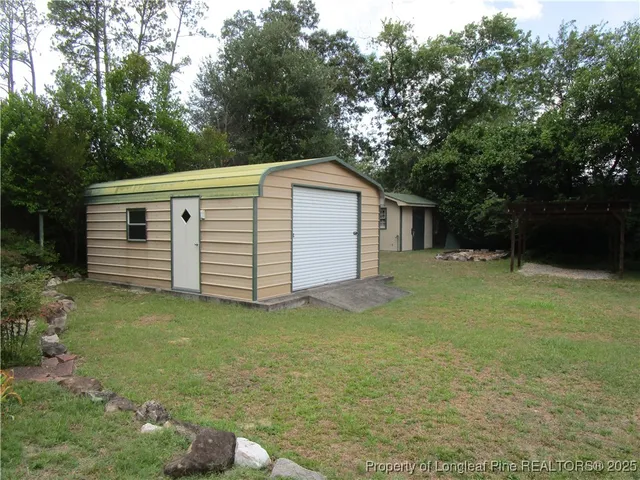 a view of a backyard with a garden