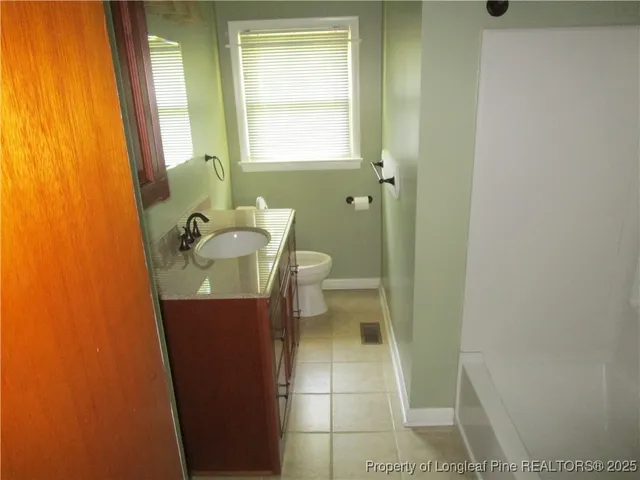 a bathroom with a sink and toilet