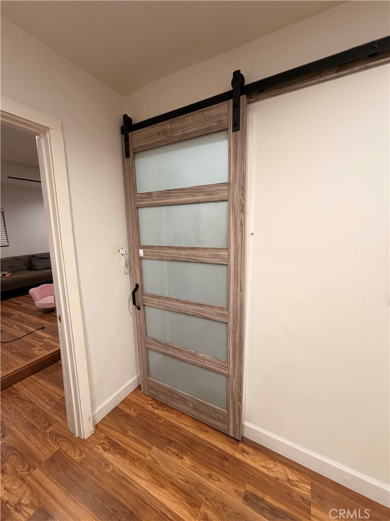 30009 Hunstock Street Castaic, CA 91384 - Photo 18 of 23 a view of a room with wooden floor