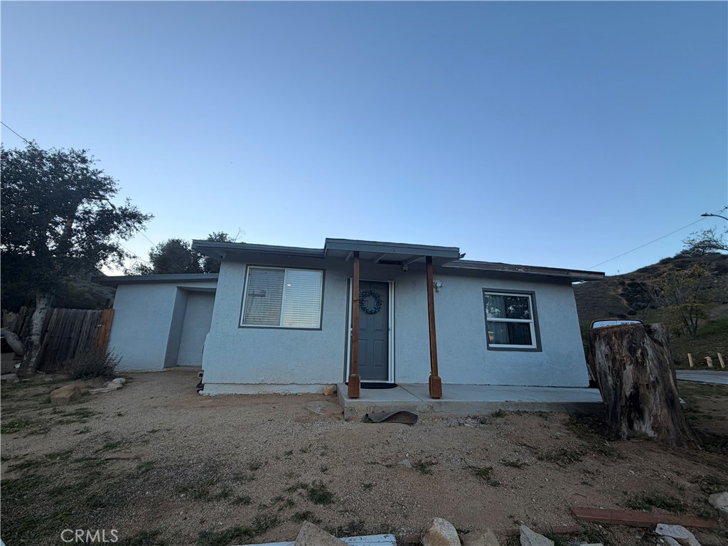 30009 Hunstock Street Castaic, CA 91384 - Photo 4 of 23 a house view with a backyard space