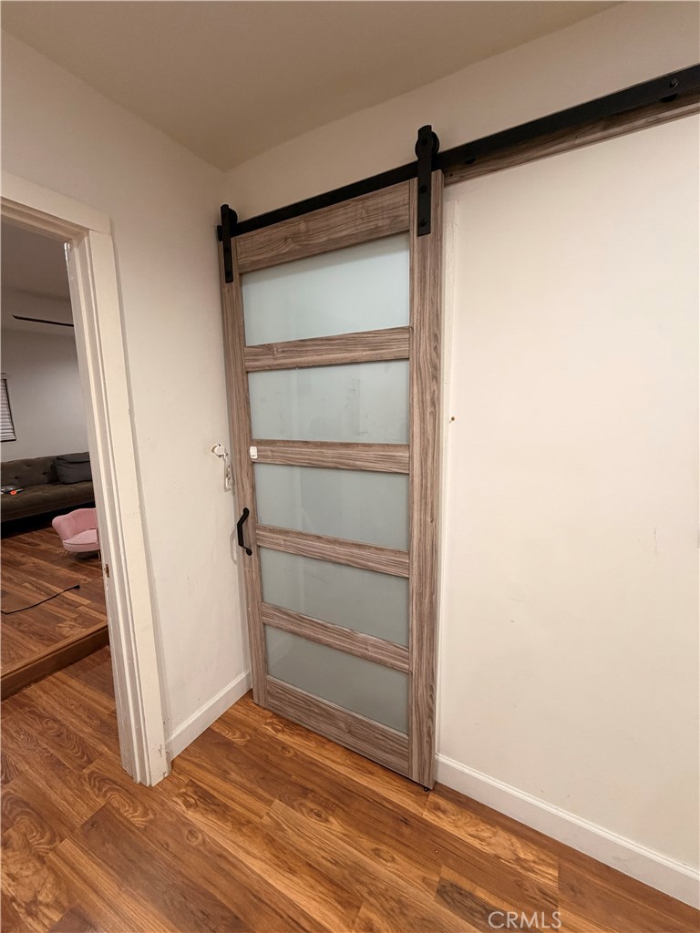 30009 Hunstock Street Castaic, CA 91384 - Photo 6 of 23 a view of a room with wooden floor