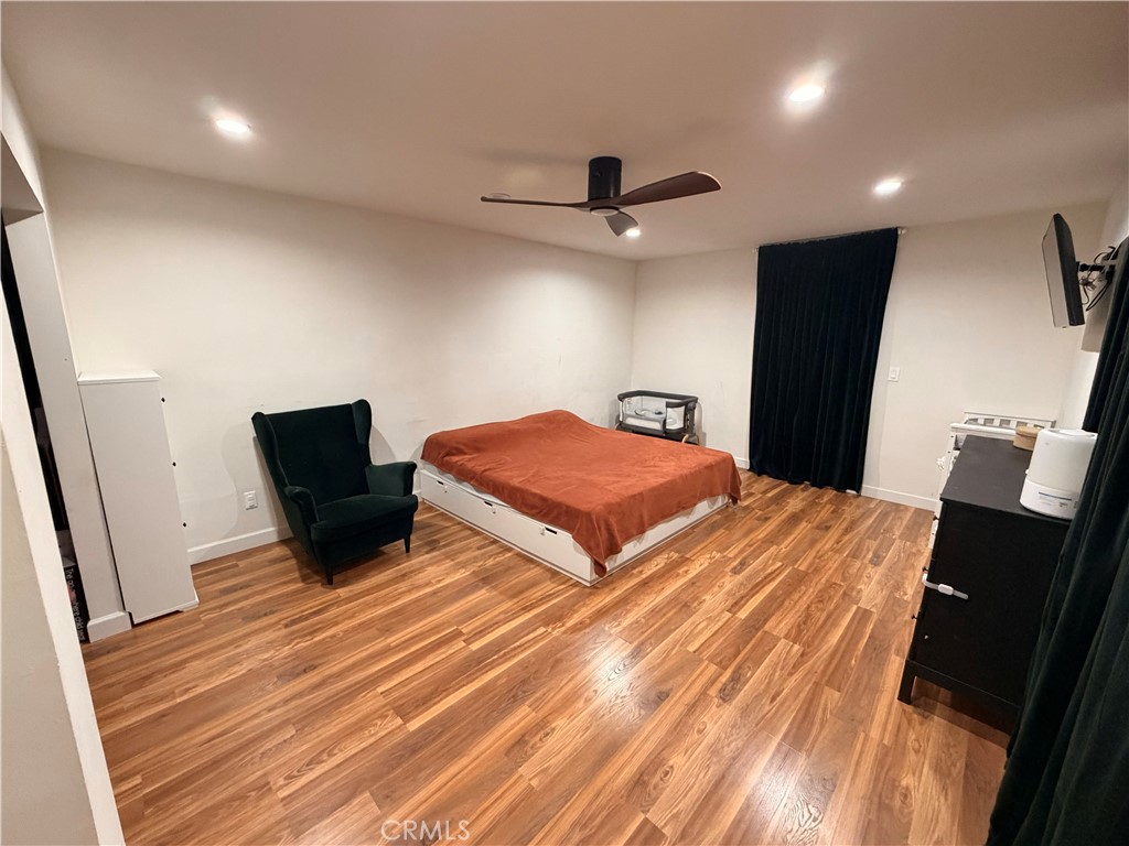 30009 Hunstock Street Castaic, CA 91384 - Photo 10 of 23 a bedroom with bed and wooden floor