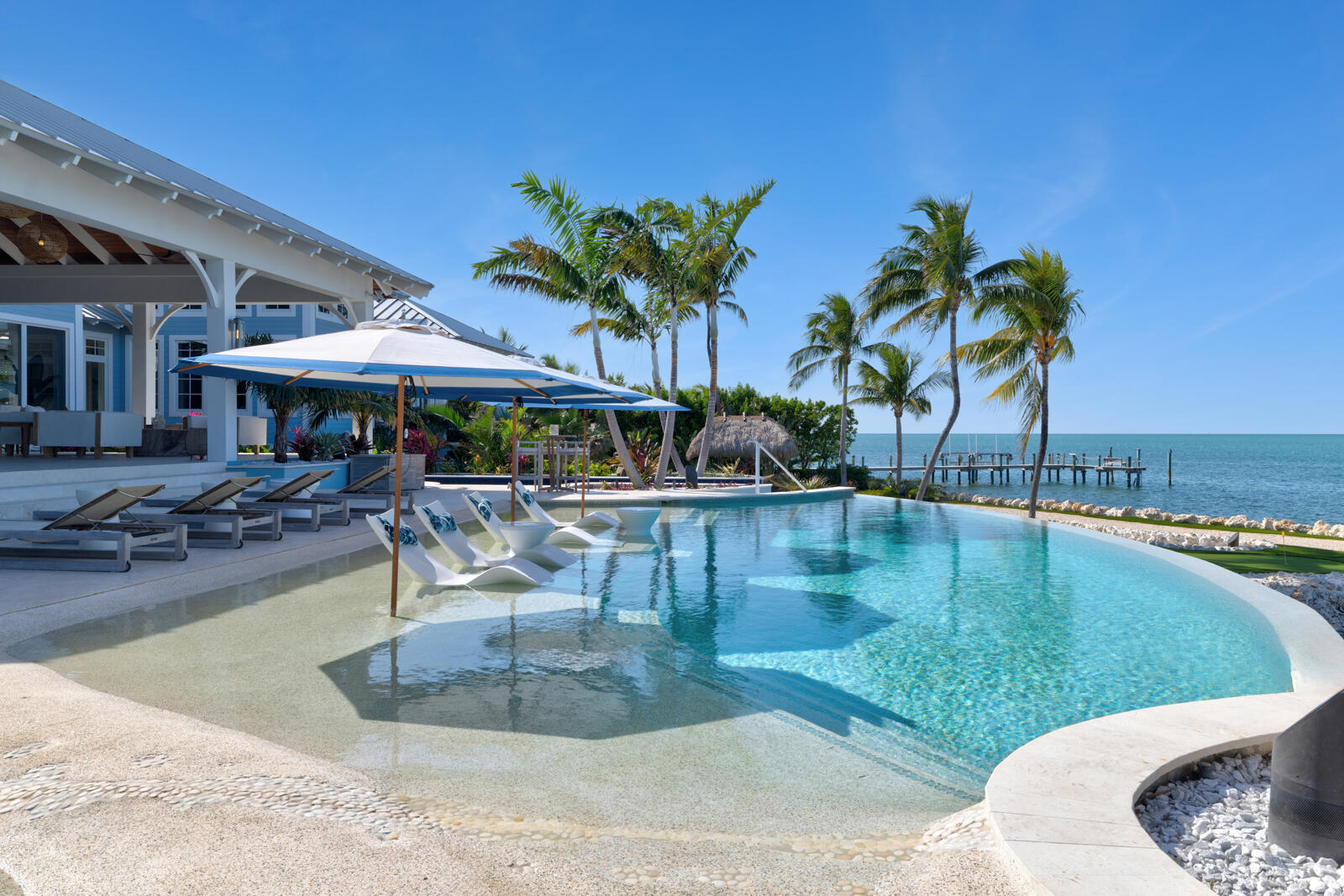 57223 Morton Street Marathon, FL 33050 - Photo 119 of 159 a view of a swimming pool with outdoor seating