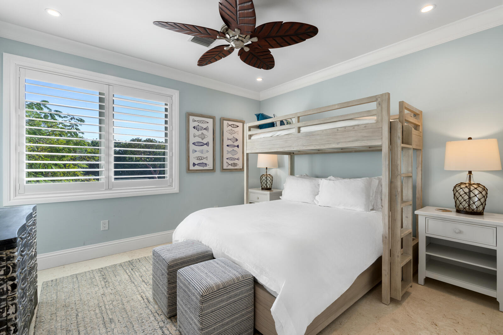 57223 Morton Street Marathon, FL 33050 - Photo 25 of 159 a bedroom with a bed and a chandelier