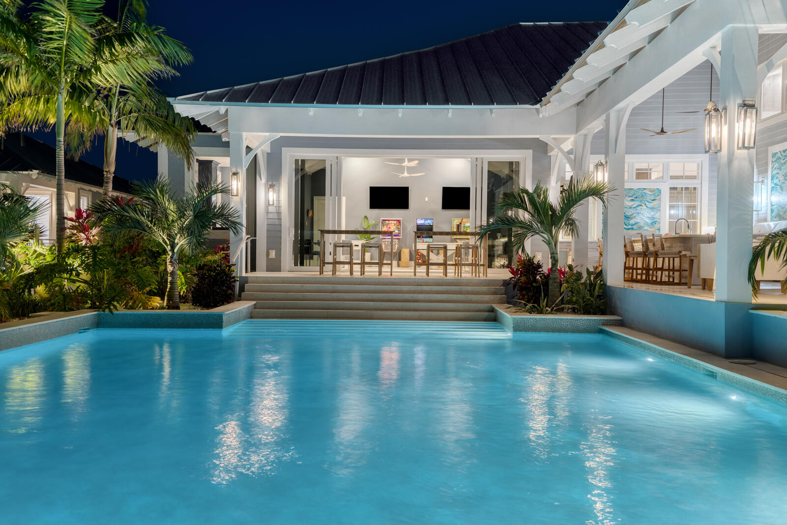 57223 Morton Street Marathon, FL 33050 - Photo 36 of 159 Outdoor kitchen & pool night