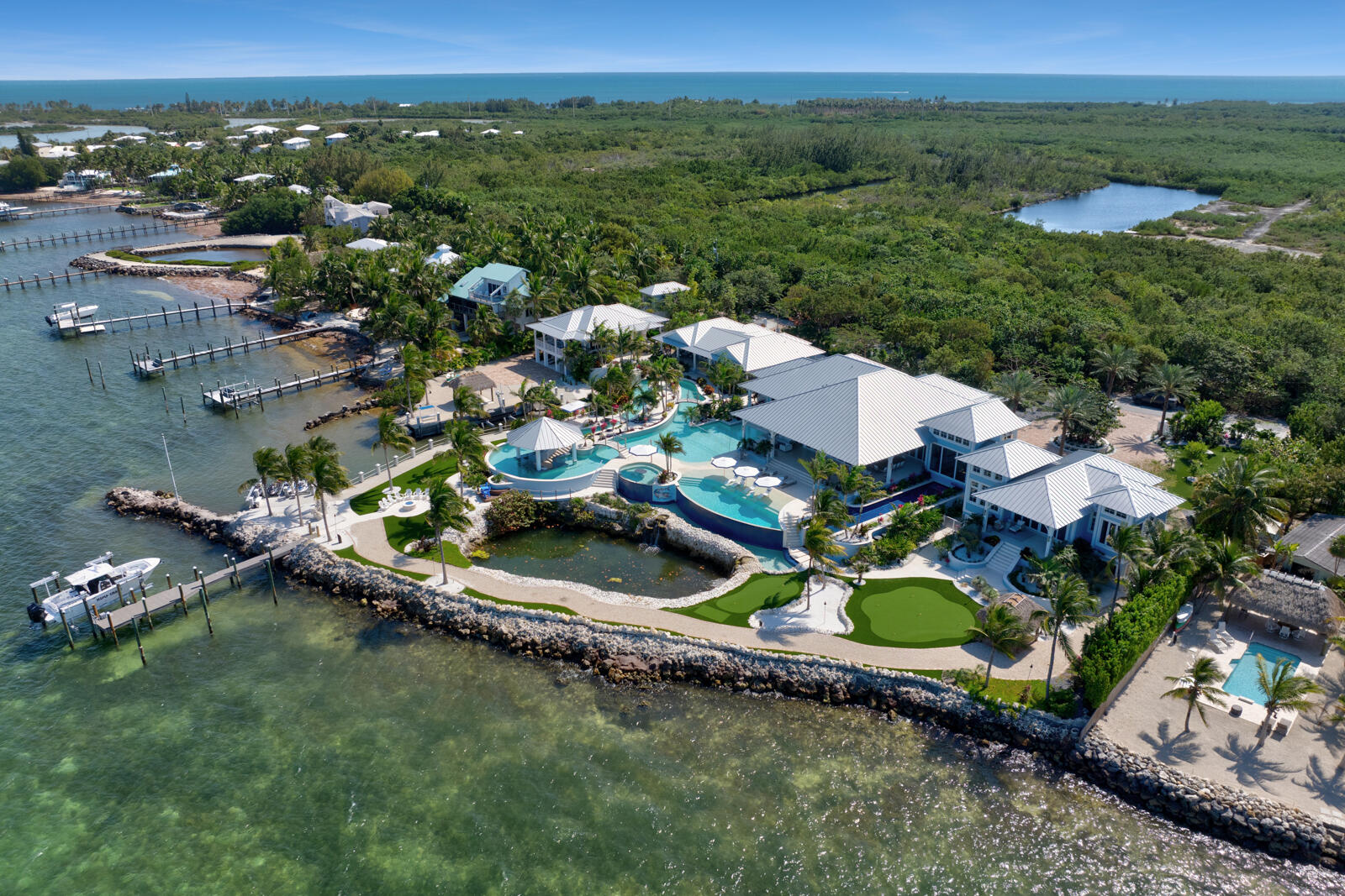 57223 Morton Street Marathon, FL 33050 - Photo 56 of 159 an aerial view of a house with a garden and lake view