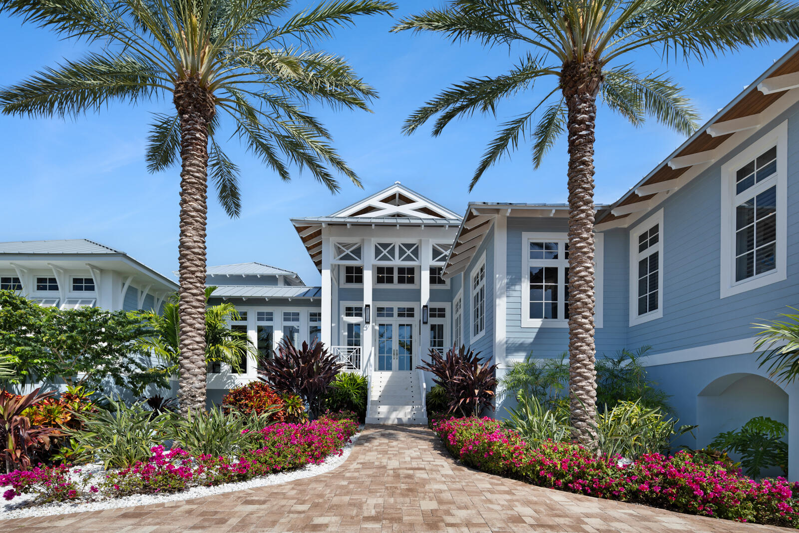 57223 Morton Street Marathon, FL 33050 - Photo 67 of 159 front view of a house with a yard and potted plants