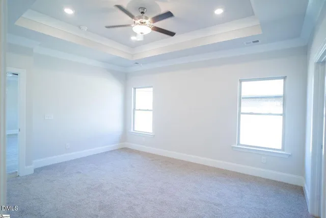 a spacious bathroom with a double vanity sink and mirror