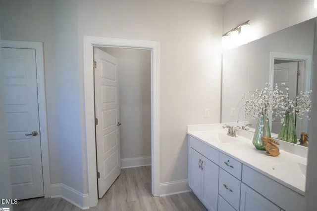 a bathroom with a shower and a sink