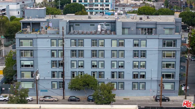 a living room with furniture and a chair