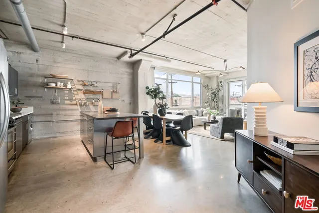a living room with lots of furniture and a flat screen tv