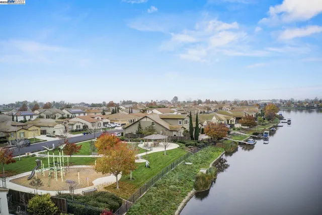 a view of a lake with houses with outdoor space
