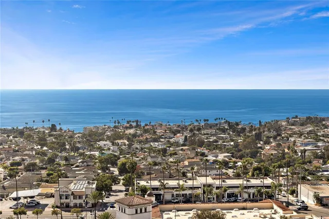 an aerial view of residential building and ocean