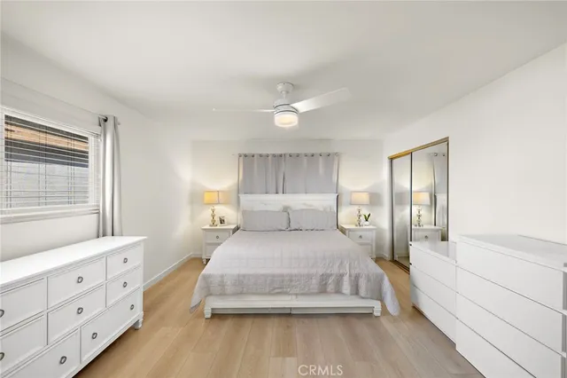 a bedroom with a large bed and a window