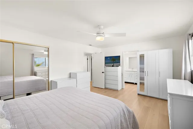 a bedroom with a bed and closet