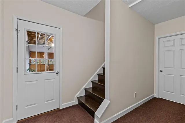 a view of an entryway with stairs