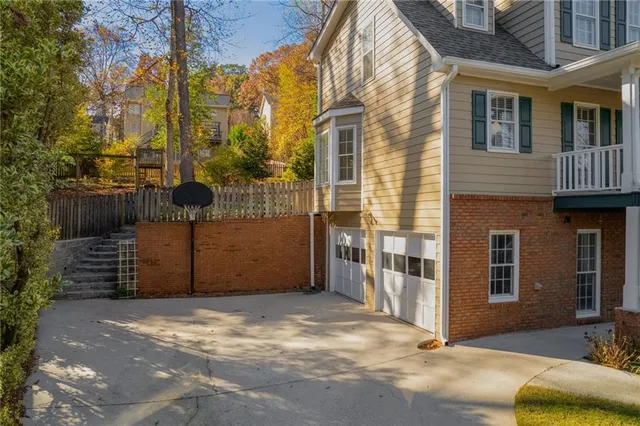a view of a brick house with many windows