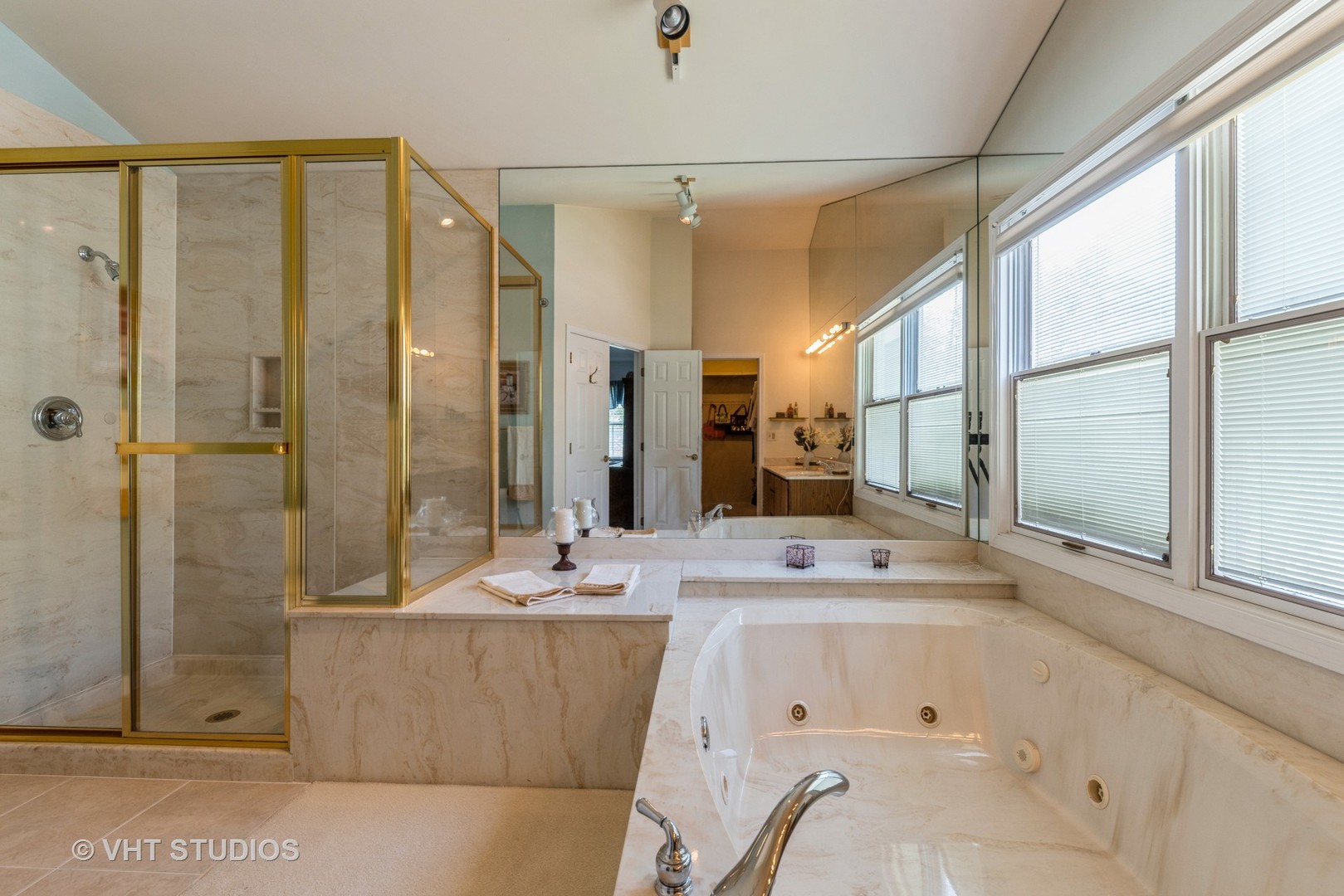 1857 Ashbury Lane, Unit 36 Inverness, IL 60067 - Photo 11 of 20 a bathroom with a double vanity sink mirror and shower