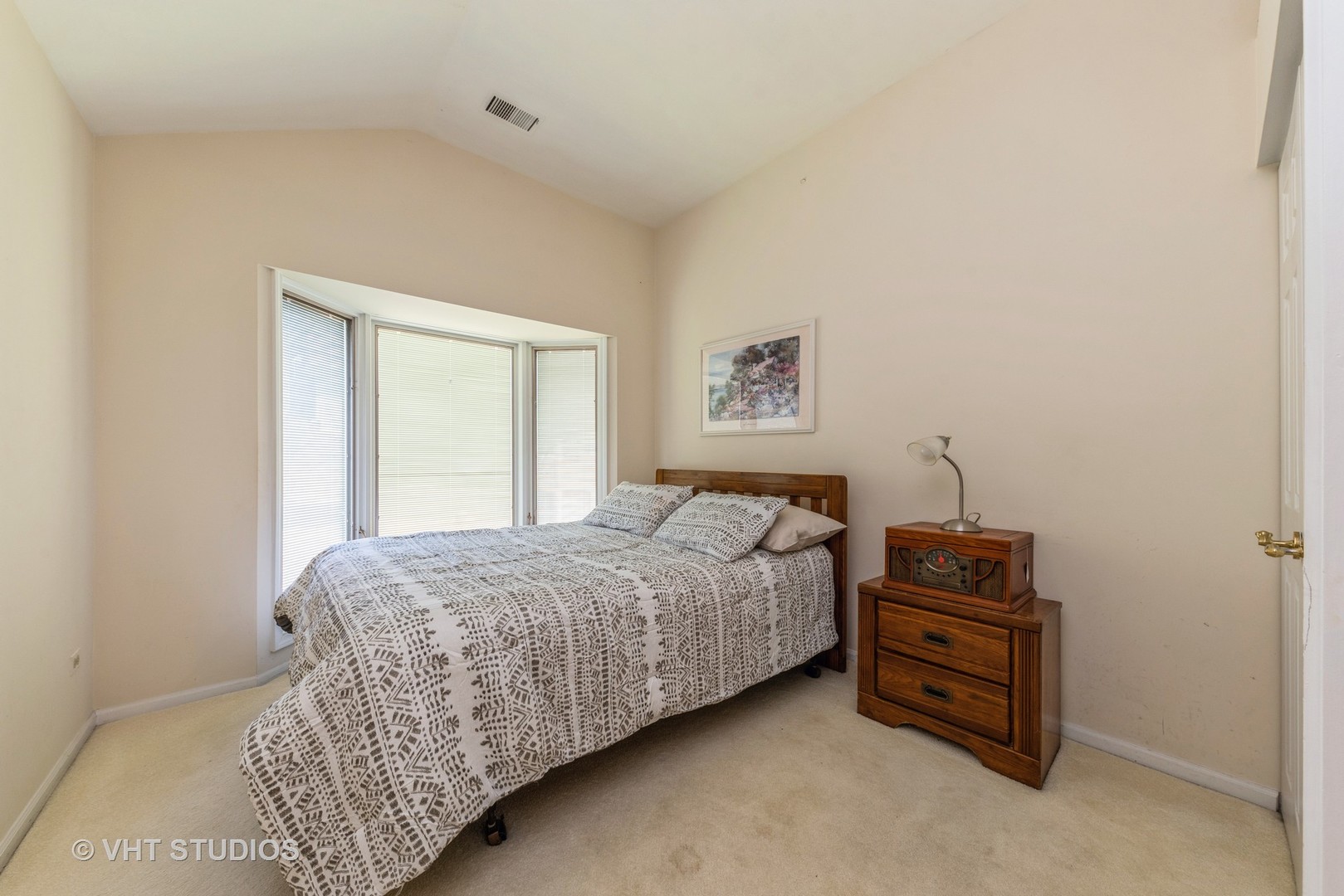 1857 Ashbury Lane, Unit 36 Inverness, IL 60067 - Photo 13 of 20 a bedroom with a bed and a cabinets