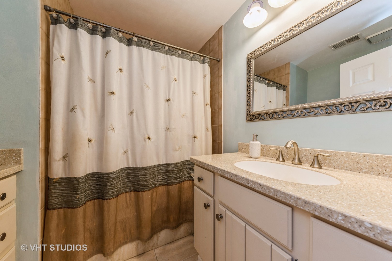 1857 Ashbury Lane, Unit 36 Inverness, IL 60067 - Photo 14 of 20 a bathroom with a granite countertop sink and a mirror