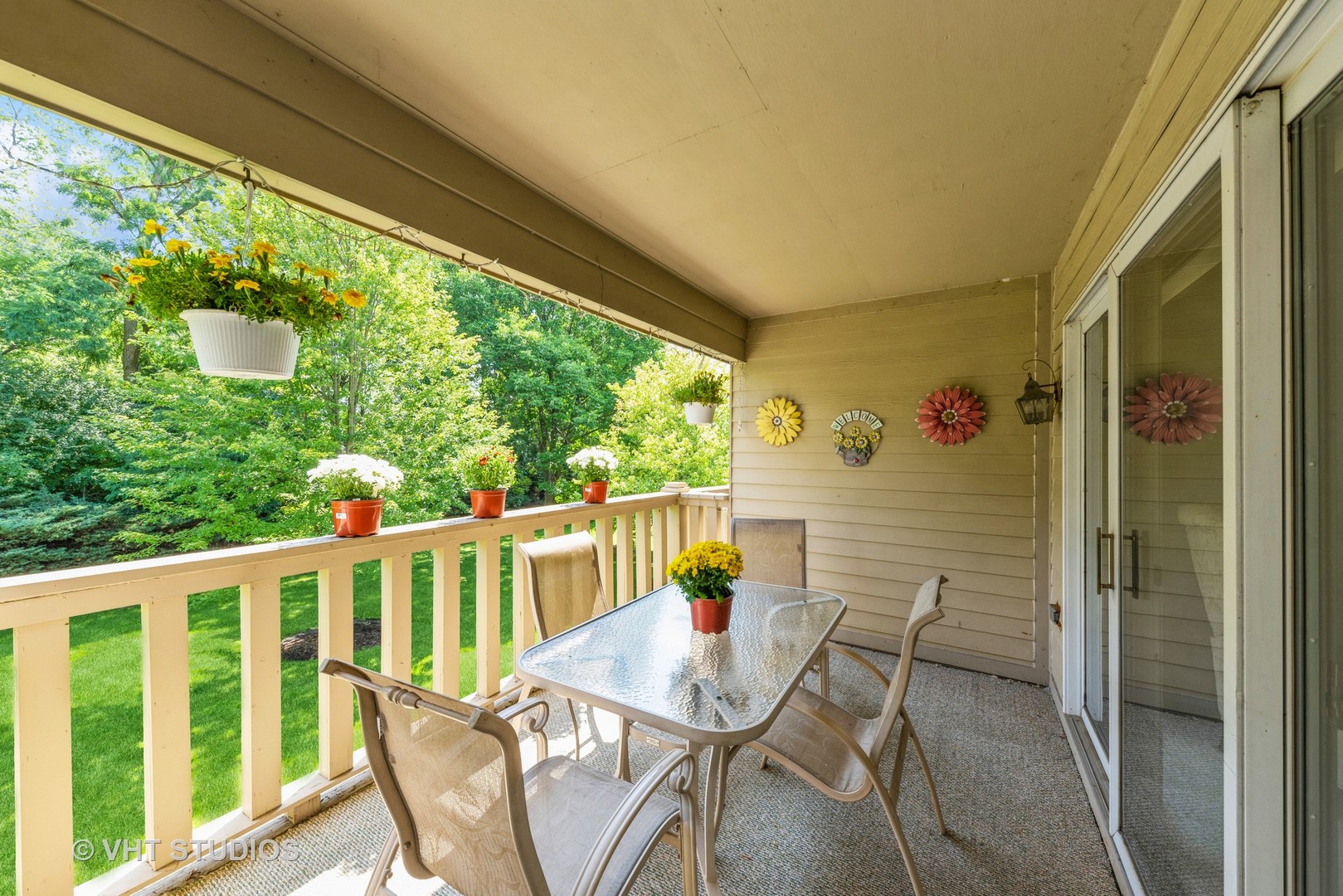 1857 Ashbury Lane, Unit 36 Inverness, IL 60067 - Photo 19 of 20 a view of a chair and table in the balcony